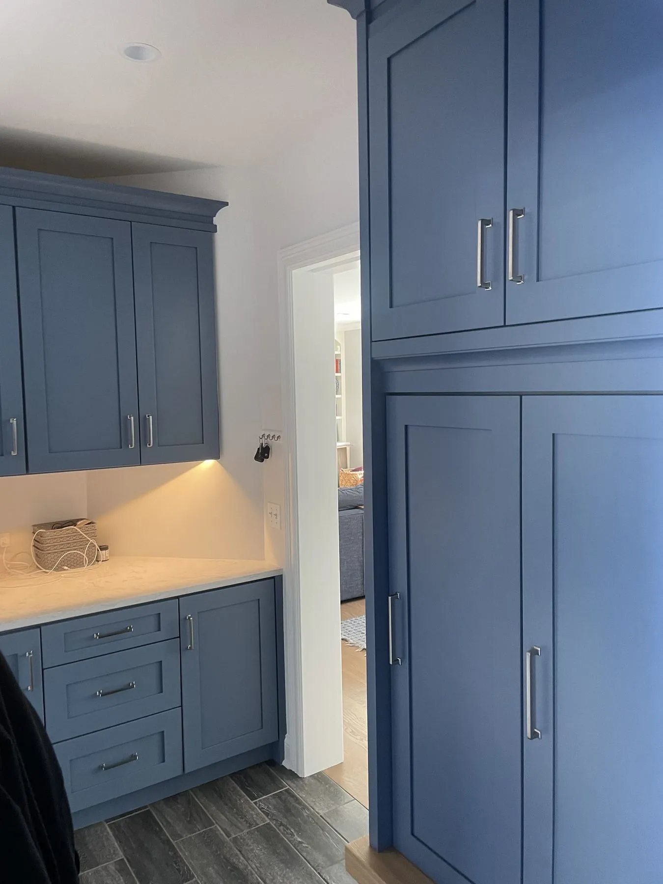 Blue cabinets and a counter with drawers