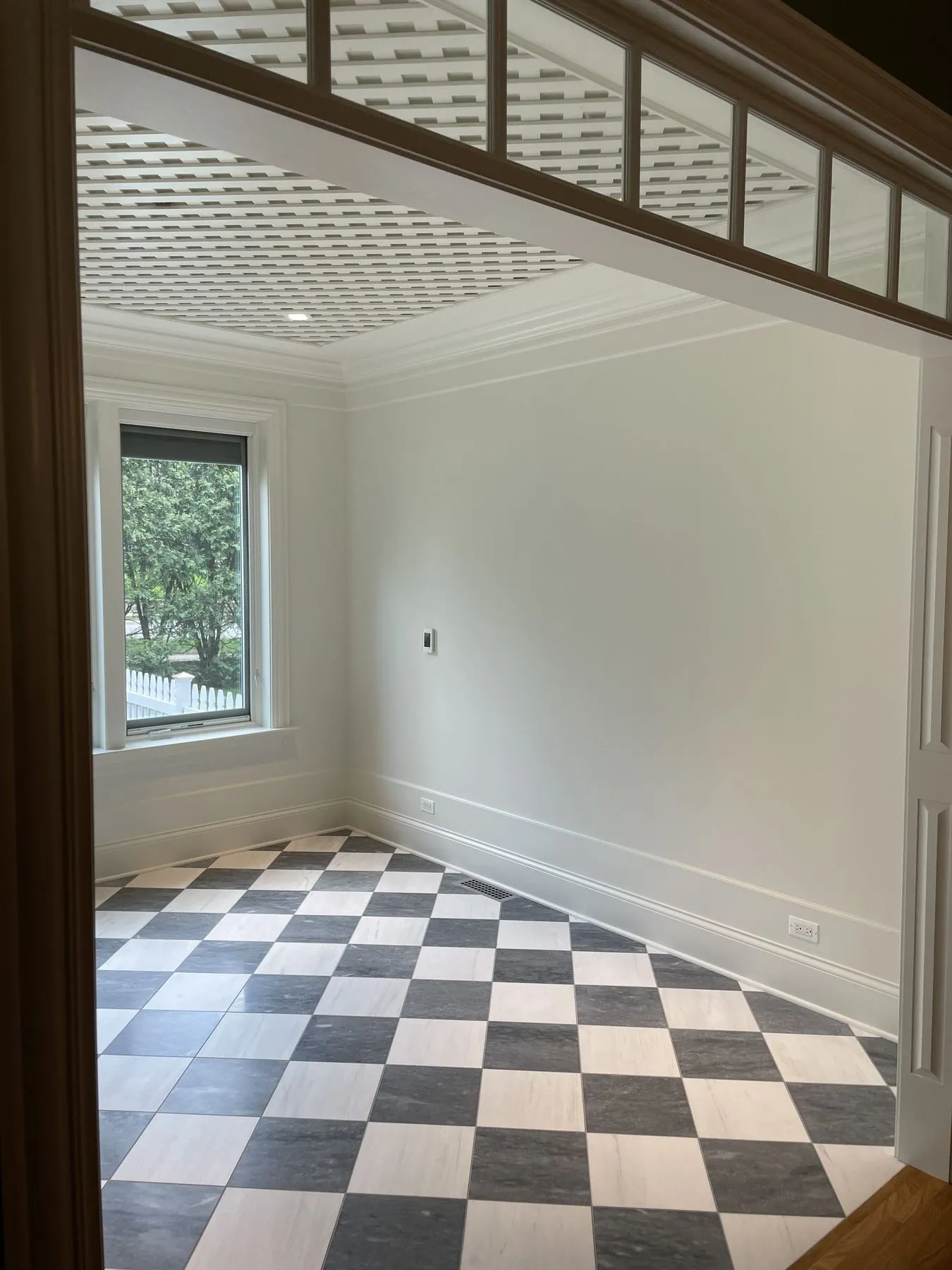 Opening with transom windows into the sunroom