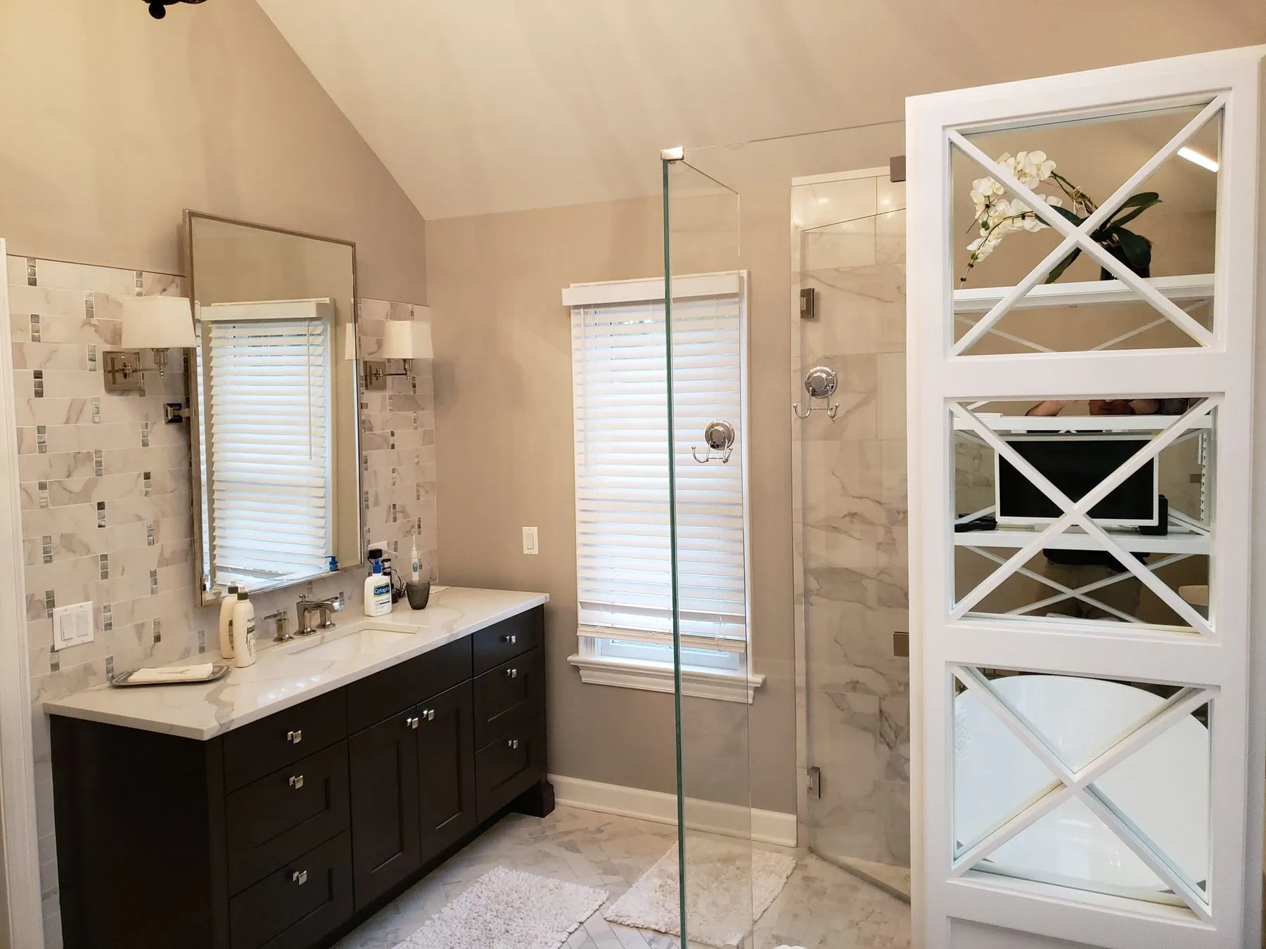 Double vanity, glass shower, and X-pattern shelving