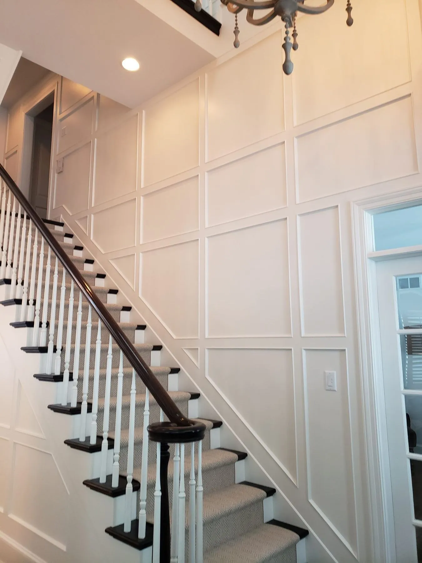 Paneling rising to the second floor