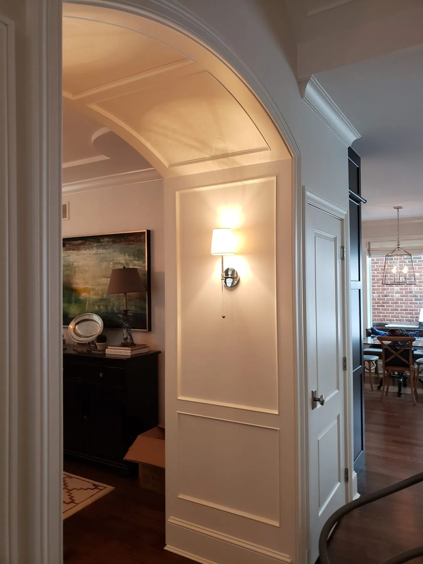 Arched hallway with paneled walls