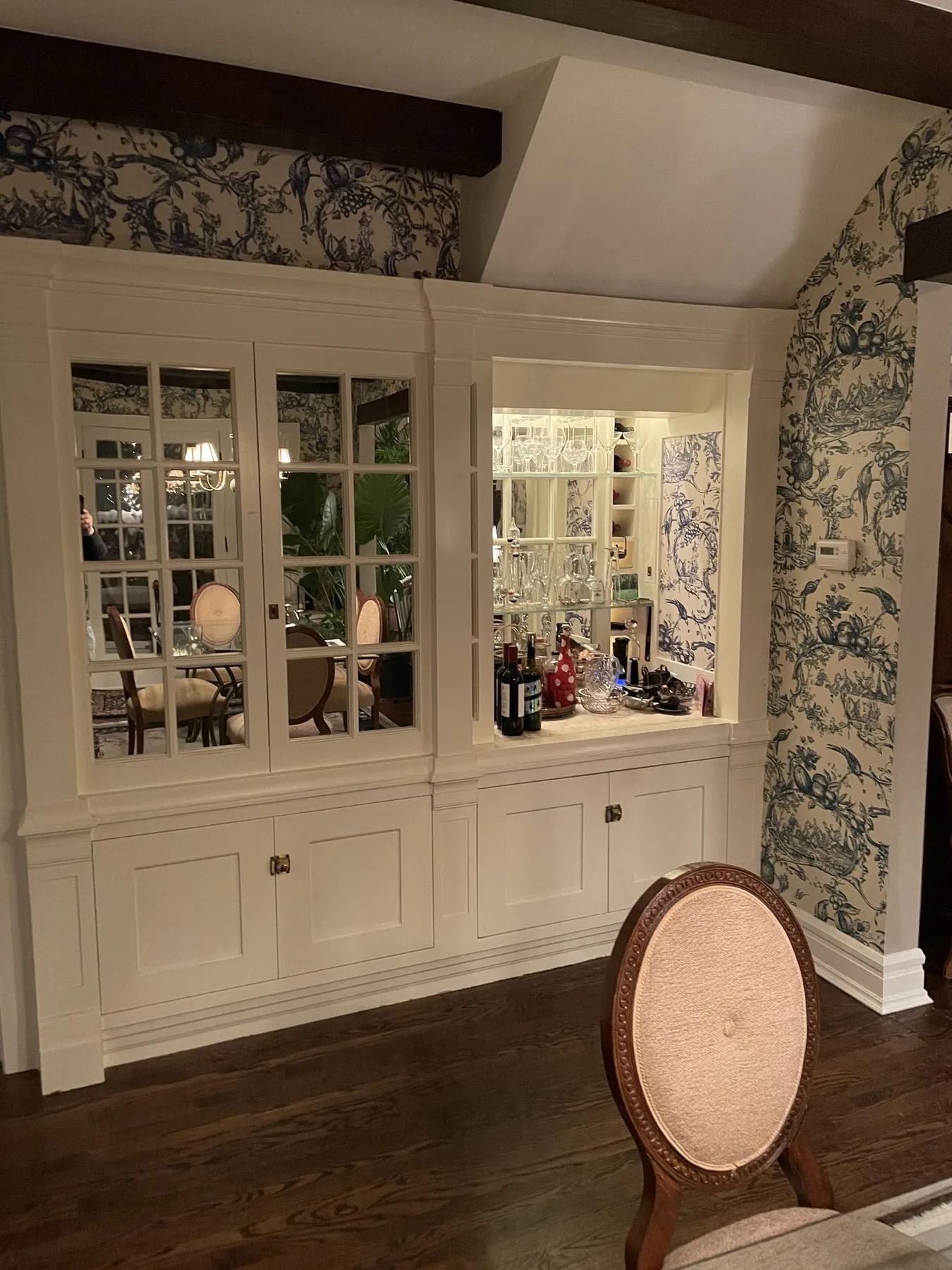 Glass-front bar cabinet in a dining room