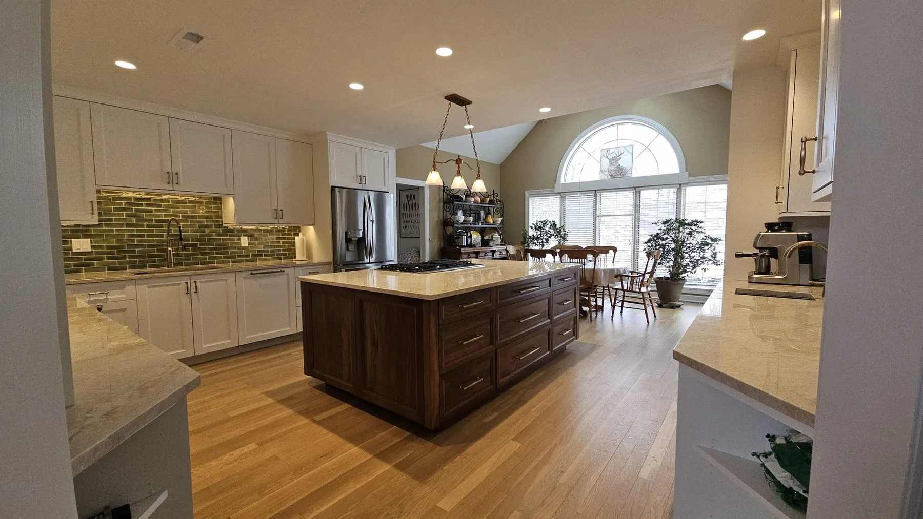 White kitchen with a walnut island